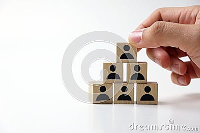 Businessman stacking wooden team blocks Stock Photo