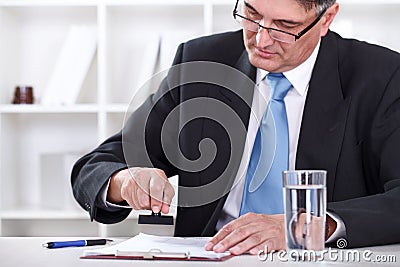 Businessman stamping document , approve contract Stock Photo