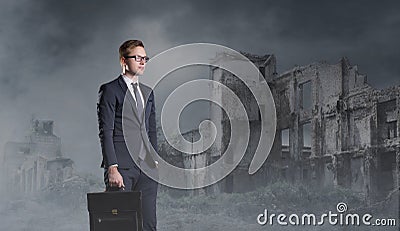 Businessman standing on apocalyptic background. Crisis, default, setback concept. Stock Photo
