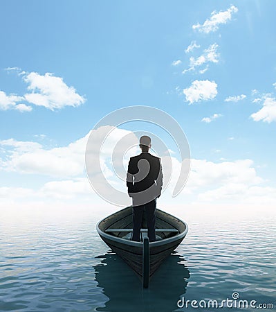 Businessman standing on a boat Stock Photo