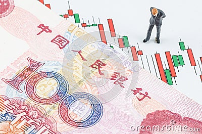 Businessman standing with Chinese banknote on the cand Stock Photo