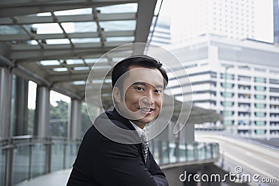 Businessman Standing On Footbridge Stock Photo