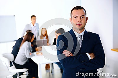 Businessman standing in front of business meeting Stock Photo