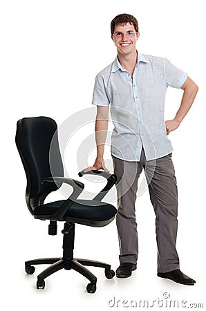 The businessman stands an armchair Stock Photo