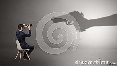 Businessman staying and offering stuffs for an armed shadow hand Stock Photo