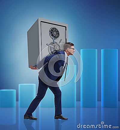 BUsinessman stealing metal safe from bank Stock Photo
