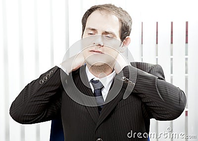 Businessman with a stiff neck Stock Photo