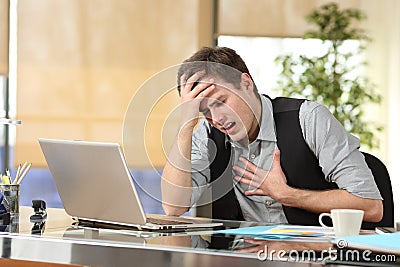 Businessman suffering an anxiety attack Stock Photo