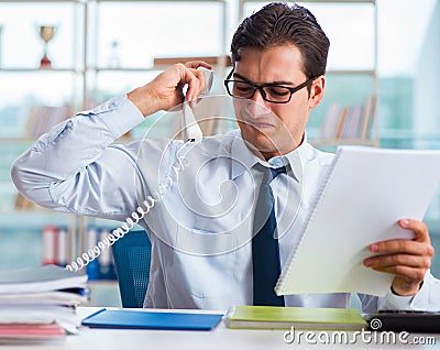 Businessman suffering from excessive armpit sweating Stock Photo