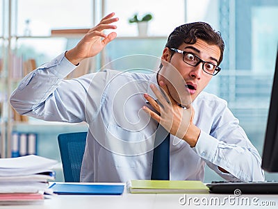 Businessman suffering from excessive armpit sweating Stock Photo