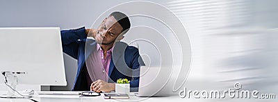Businessman Suffering From Neck Pain Stock Photo