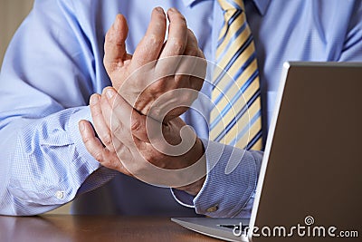 Businessman Suffering From Repetitive Strain Injury (RSI) Stock Photo