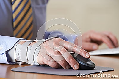 Businessman Suffering From Repetitive Strain Injury (RSI) Stock Photo