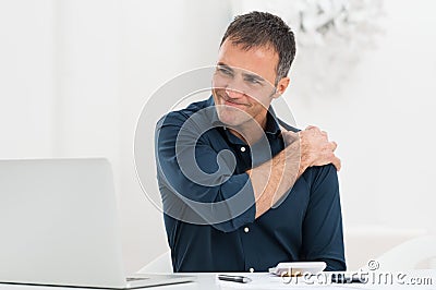 Businessman Suffering From Shoulder Pain Stock Photo