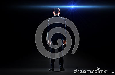 Businessman in suit from back with laser light Stock Photo