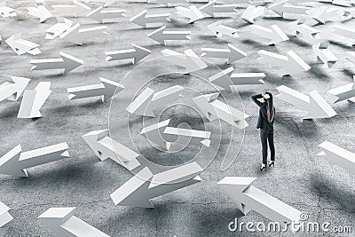 Businessman in suit looking on group arrows Stock Photo