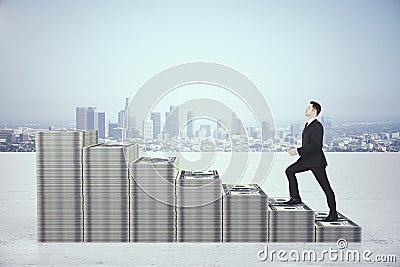 Businessman in suit rises in stacks of dollars money Stock Photo