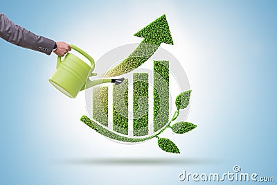 Businessman supporting green economy growth Stock Photo