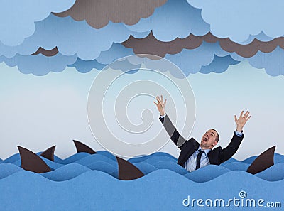 Businessman surrounded by sharks in stormy sea. Stock Photo