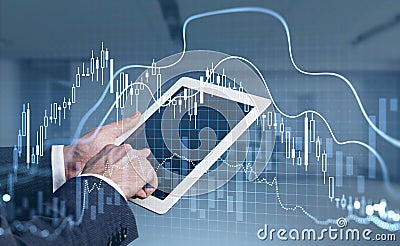 Businessman with tablet in hands trades on stock market Stock Photo