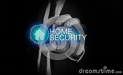 Businessman takes a hand home icon with inscription home security concept Stock Photo