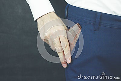 Businessman takes his wallet out of his pocket Stock Photo