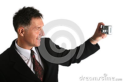 Businessman taking autoportrait photo with compact digital camera probably for his work aplication Stock Photo