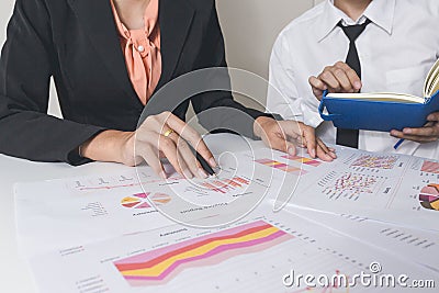 Businessman or Team discussing the charts and graphs showing the results of their successful teamwork.Financial reports are set of Stock Photo