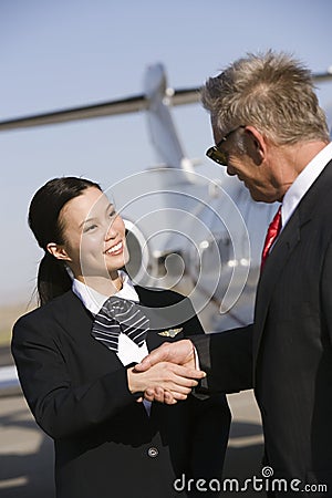 Businessman Thanking Stewardess Stock Photo