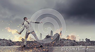 Businessman throwing petrol bomb . Mixed media Stock Photo