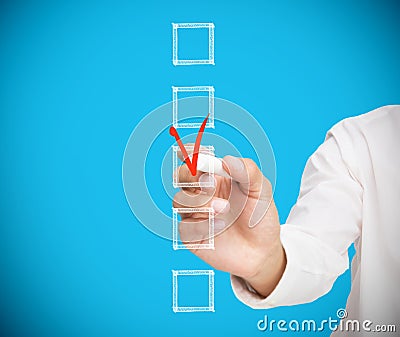 Businessman ticking a box in red Stock Photo