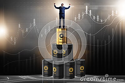 The businessman on top of oil barrels Stock Photo