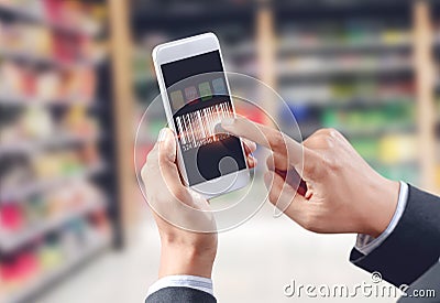 Businessman touch barcode on mobile device Stock Photo