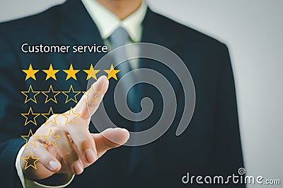 Businessman touching button to select five stars.Customer satisfaction and marketing survey rating concept Stock Photo