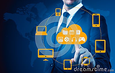 Businessman touching a cloud connected to many objects on a virtual screen, concept about internet of things Stock Photo