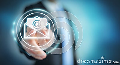 Businessman touching 3D rendering flying email icon with his fin Stock Photo