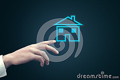 Businessman touching house icone in screen Stock Photo