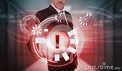 Businessman touching futuristic warning icon interface Stock Photo