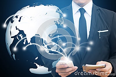 Businessman touching global network and mobile phone. communication and social media concepts Stock Photo