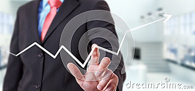 Businessman touching hand-drawn arrow going up Stock Photo