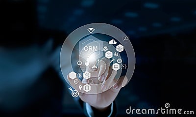 Businessman touching icon CRM on modern virtual interface Stock Photo