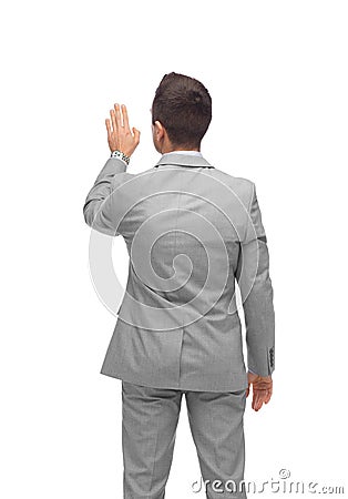 Businessman touching something imaginary Stock Photo