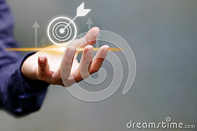 Businessman touching target icon virtual and up arrow. Strategic planning and business success Stock Photo