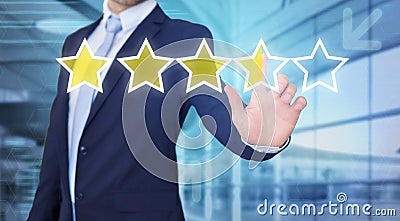 Businessman touching technology interface with ranking stars Stock Photo