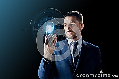 Businessman with transparent smartphone Stock Photo