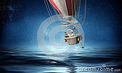 Businessman travel on air balloon Stock Photo