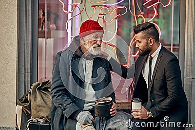 Being extremely kind to homeless people Stock Photo