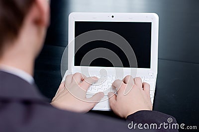 Businessman typing on his notebook Stock Photo