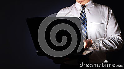 Businessman Typing on Laptop in The Dark Stock Photo