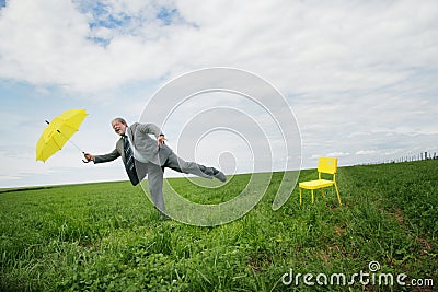 Businessman with umbrella Stock Photo